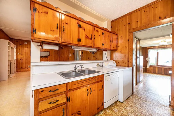 a kitchen with a sink and cabinets