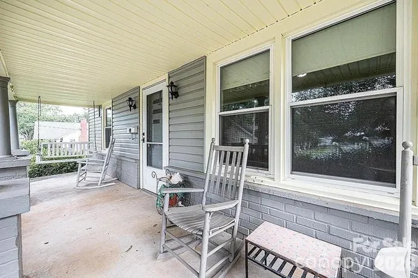 a view of a garden with a bench in a garden