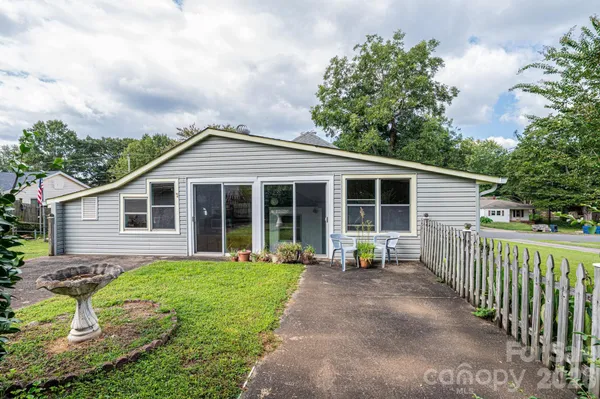 a view of a kitchen with a sink and cabinets
