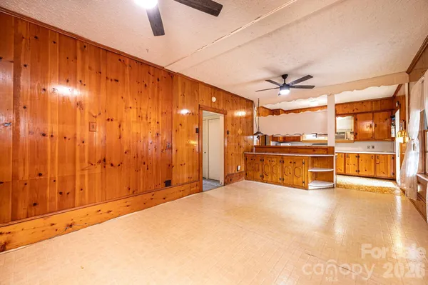 a view of a kitchen with a sink and a window