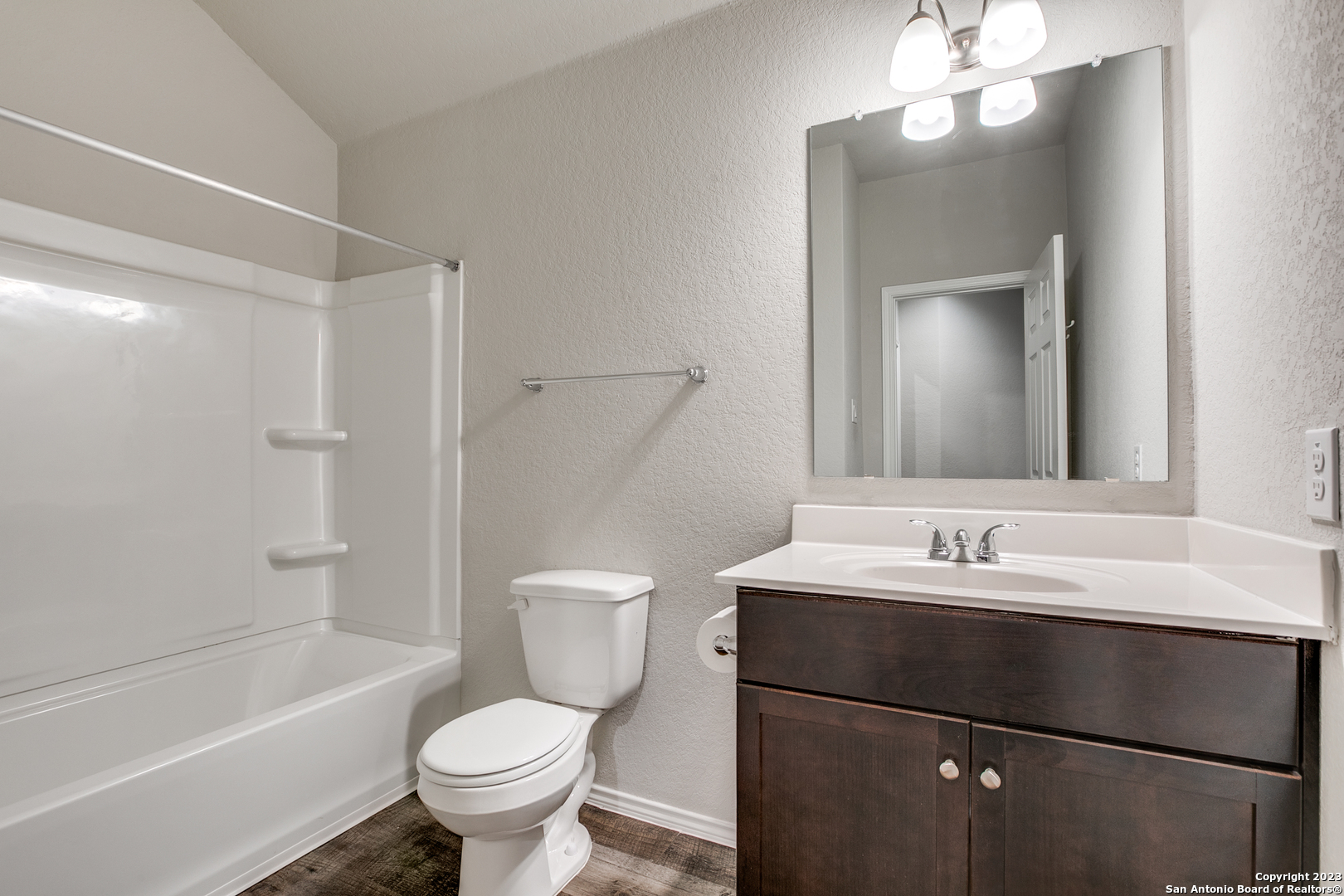 2025 Rhesus View San Antonio, TX 78245 - Photo 11 of 13 a bathroom with a sink toilet and shower