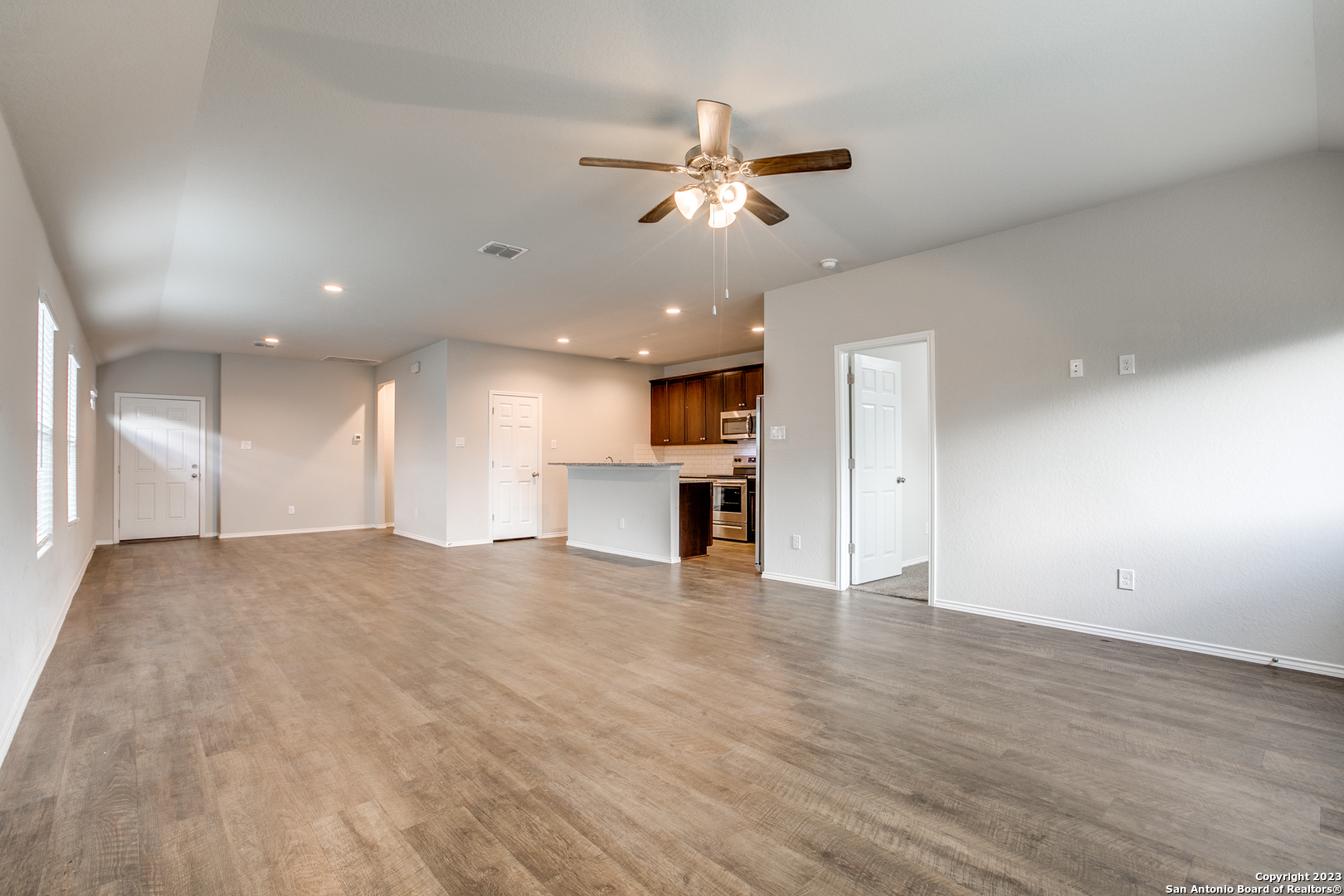 2025 Rhesus View San Antonio, TX 78245 - Photo 3 of 13 a view of an empty room and kitchen view
