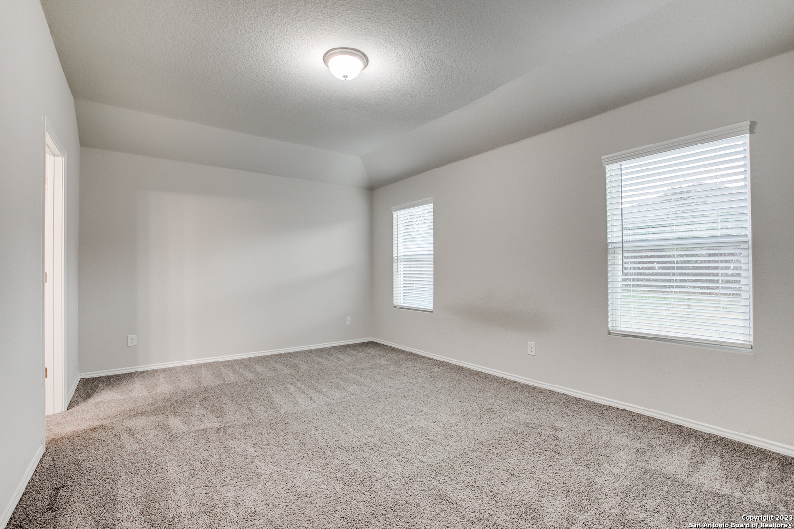 2025 Rhesus View San Antonio, TX 78245 - Photo 6 of 12 an empty room with a window