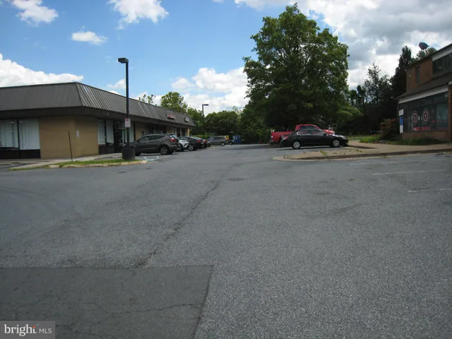 a view of street with parked cars