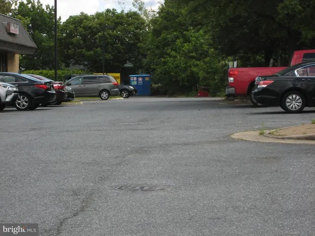 a view of street with parked cars