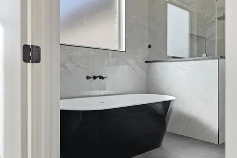 a bathroom with a shower and a toilet