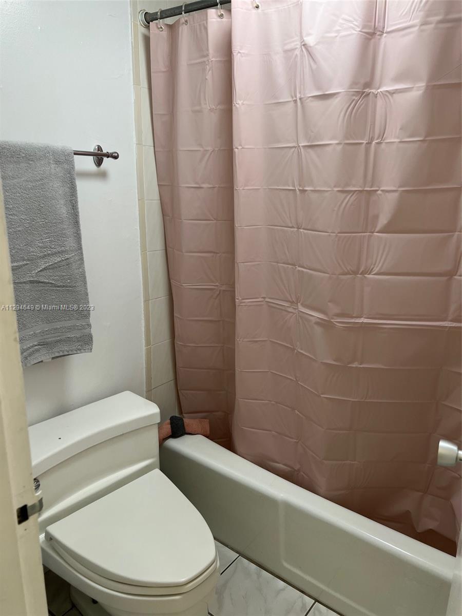 100 Lincoln Road, Unit 1001 Miami Beach, FL 33139 - Photo 18 of 62 a white toilet and shower