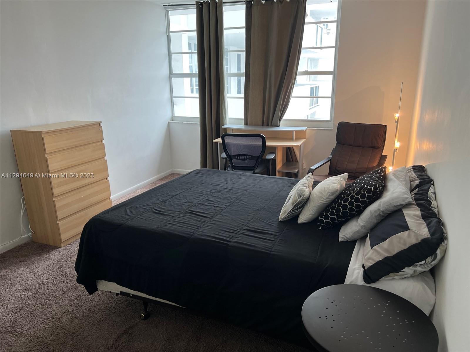 100 Lincoln Road, Unit 1001 Miami Beach, FL 33139 - Photo 8 of 62 a bedroom with a bed and window