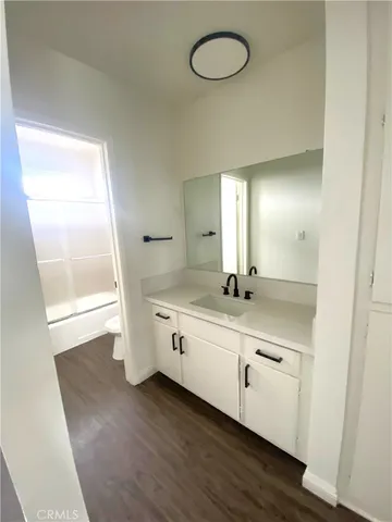 a bathroom with a double vanity sink and mirror