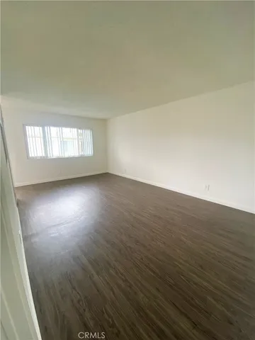 a kitchen with granite countertop white cabinets and stainless steel appliances