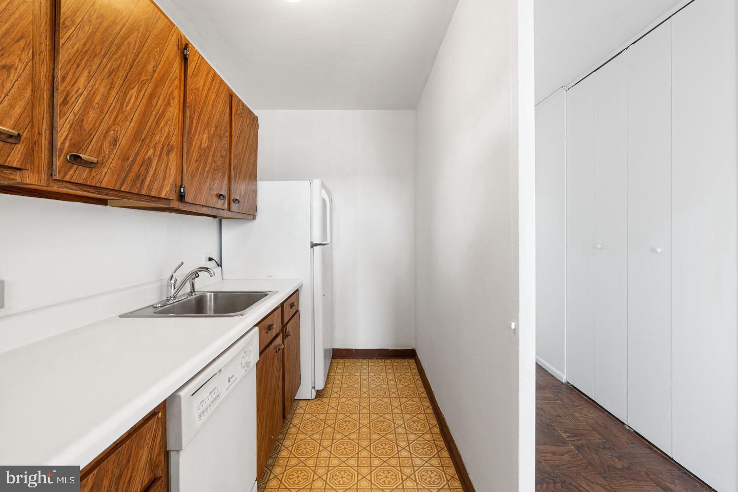 200 Locust Street, Unit 27FN Philadelphia, PA 19106 - Photo 19 of 48 a kitchen with a sink and a cabinets