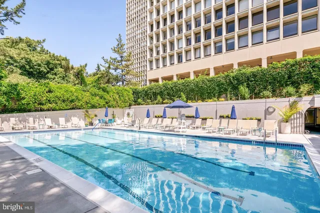 a view of building with a swimming pool