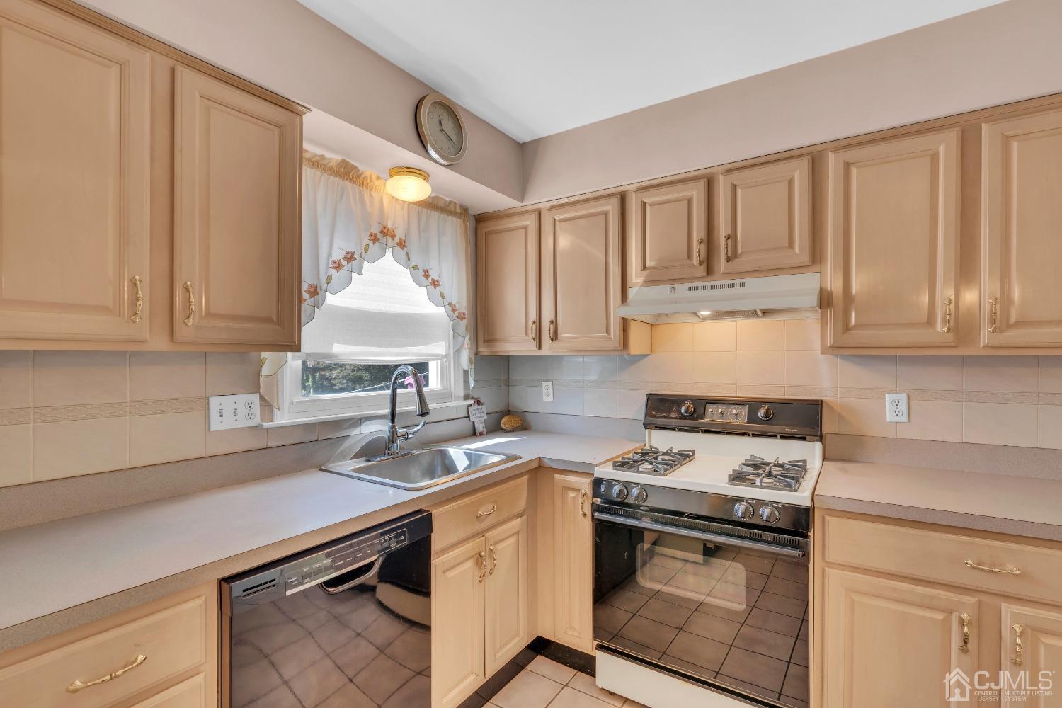 1 Robinhood Drive Sayreville, NJ 08859 - Photo 11 of 29 a kitchen with furniture a sink and a stove