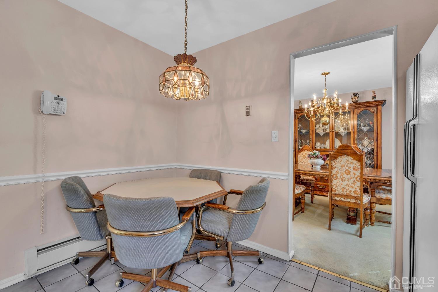 1 Robinhood Drive Sayreville, NJ 08859 - Photo 12 of 29 a view of a dining room with furniture and chandelier