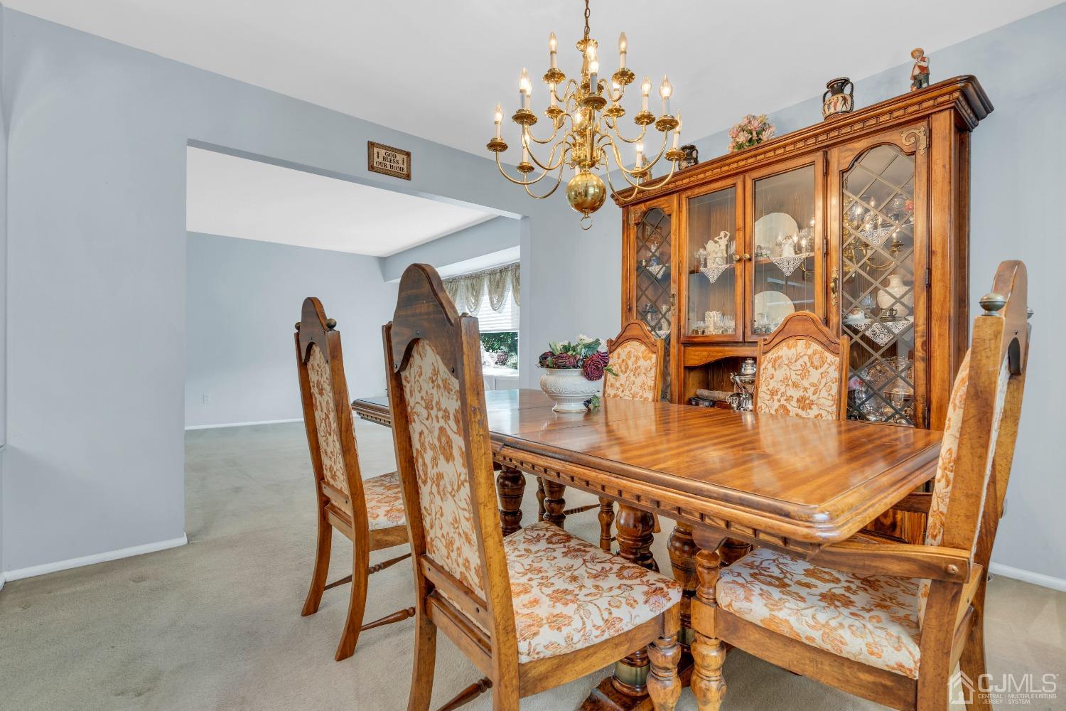 1 Robinhood Drive Sayreville, NJ 08859 - Photo 13 of 29 a view of a dining room with furniture and chandelier