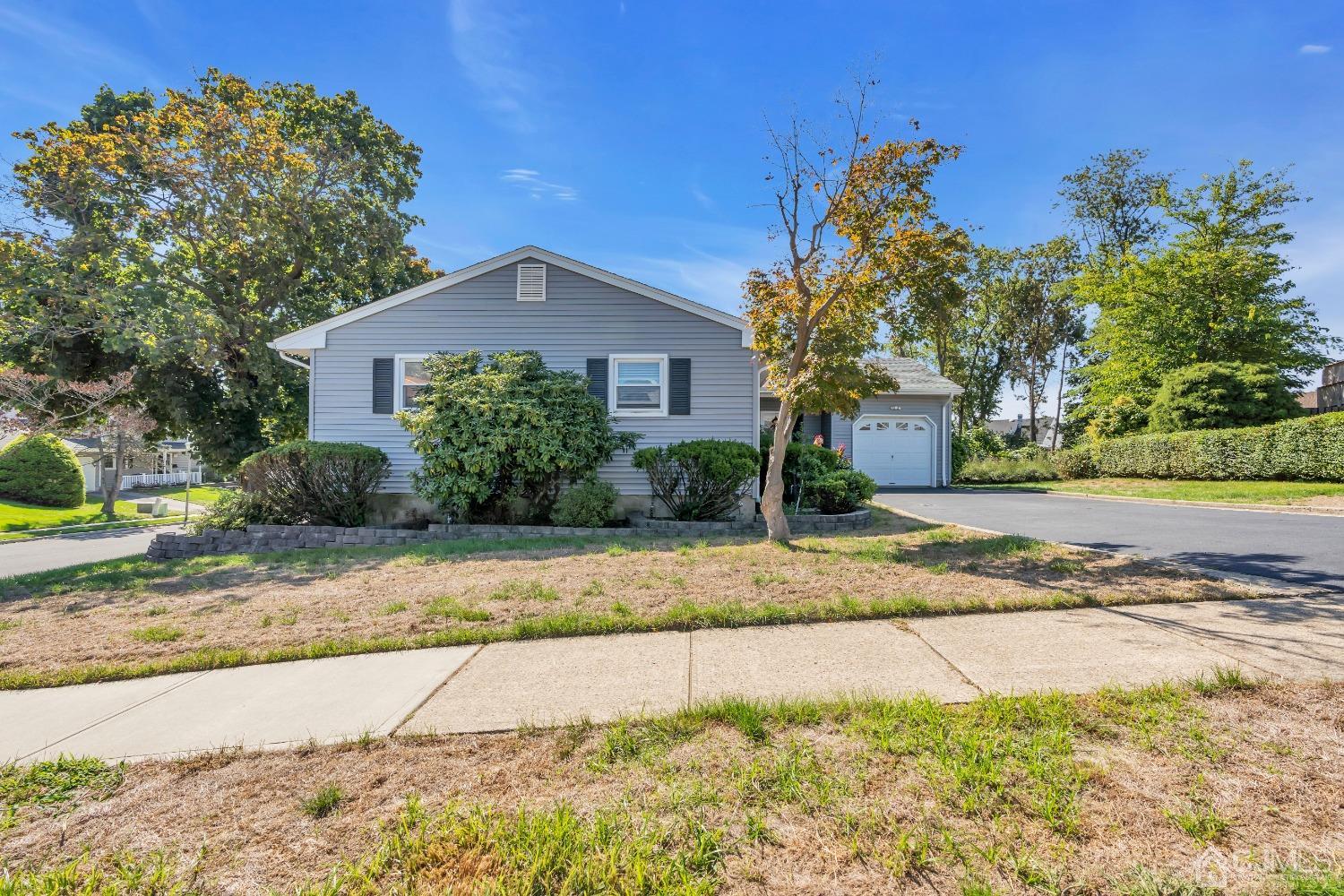 1 Robinhood Drive Sayreville, NJ 08859 - Photo 28 of 29 a front view of a house with a garden