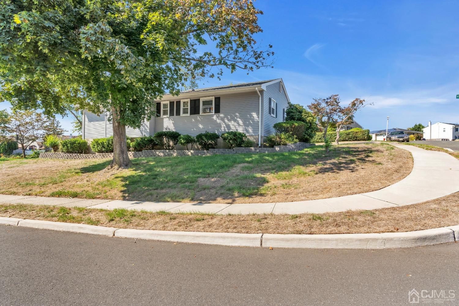 1 Robinhood Drive Sayreville, NJ 08859 - Photo 29 of 29 a view of a house with a yard and pathway