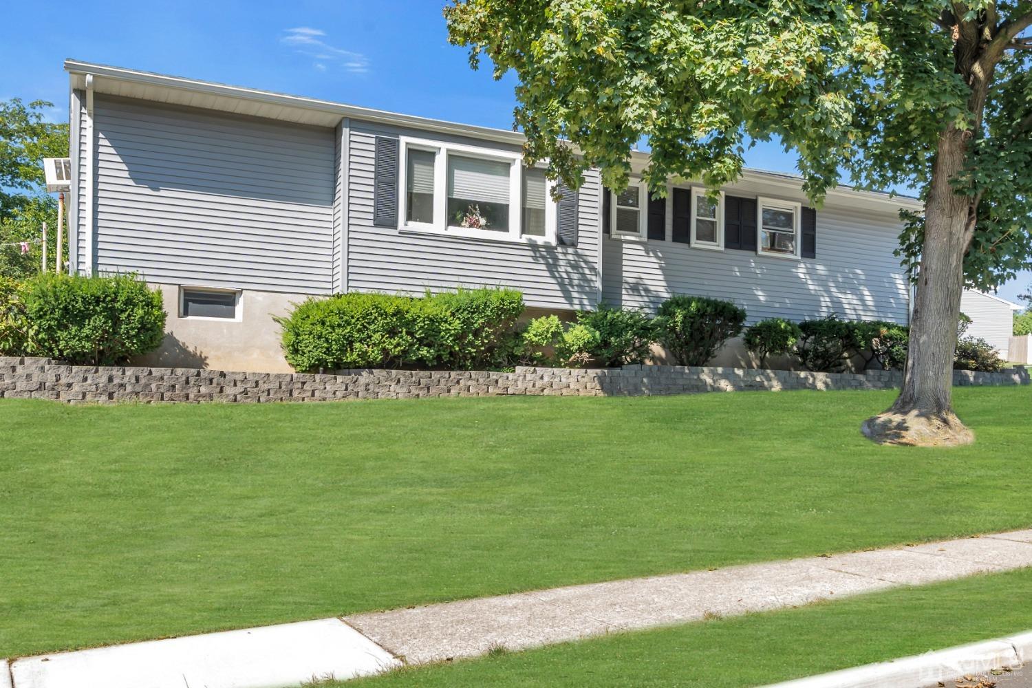 1 Robinhood Drive Sayreville, NJ 08859 - Photo 3 of 29 a front view of a house with a yard