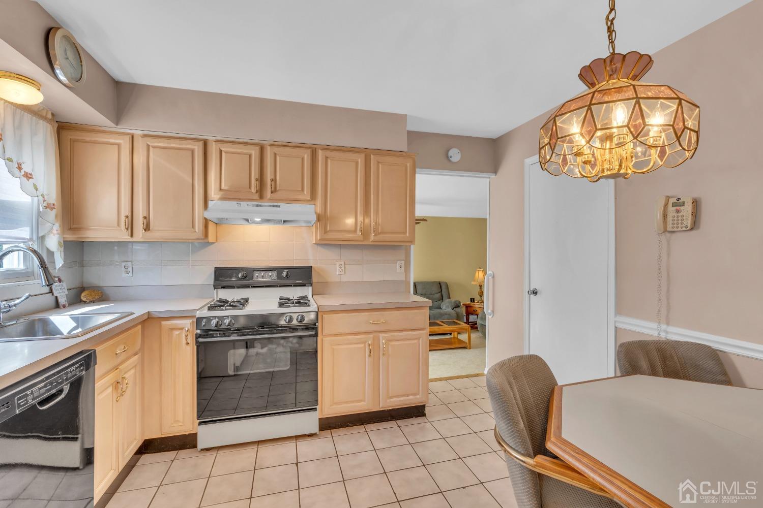 1 Robinhood Drive Sayreville, NJ 08859 - Photo 10 of 29 a kitchen with cabinets and appliances