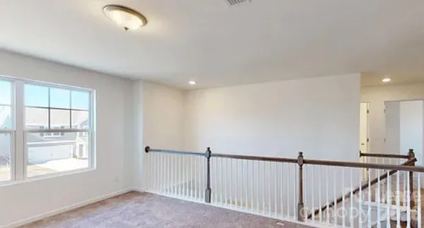 a view of a hallway with windows