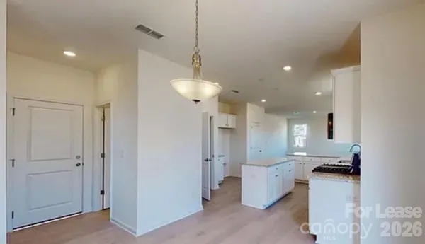 a view of a living room and kitchen