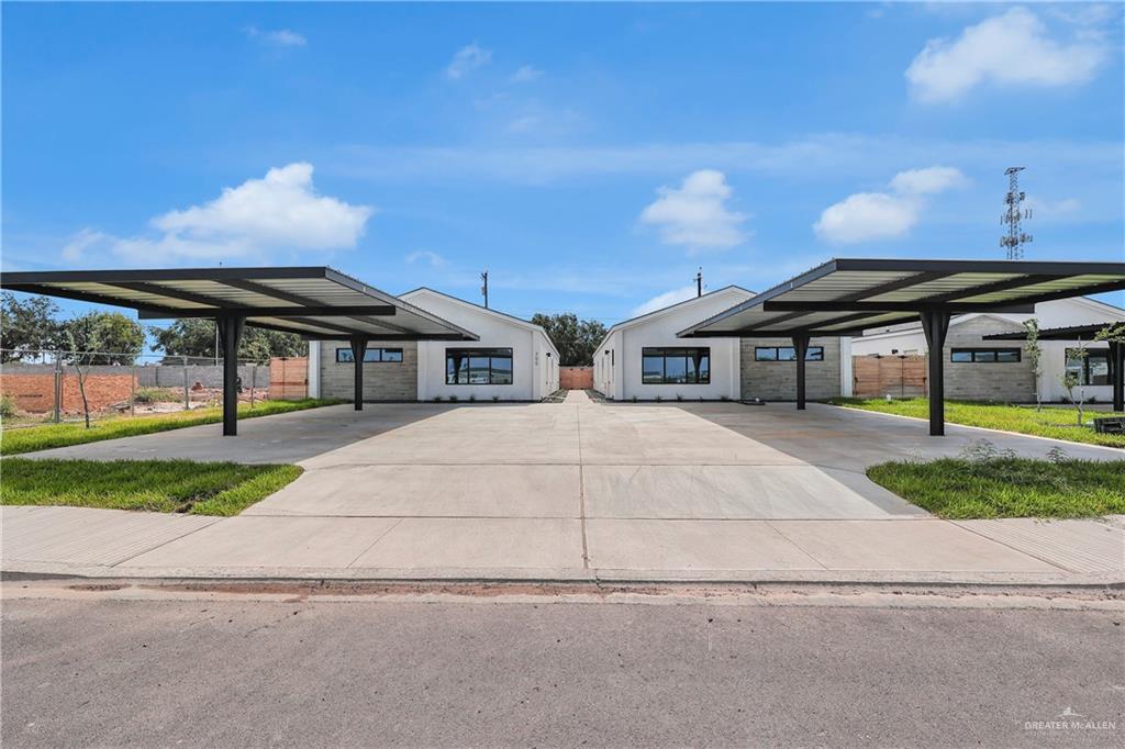 700 Oriole Road, Unit 3 Weslaco, TX 78596 - Photo 1 of 12 a front view of a house with a yard