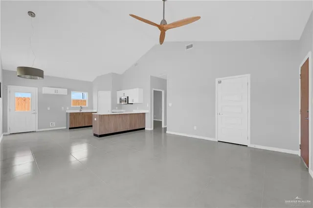 a view of an empty room with a window