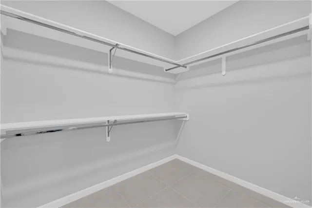 a view of an empty walk in closet