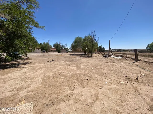 a view of open space with wooden fence