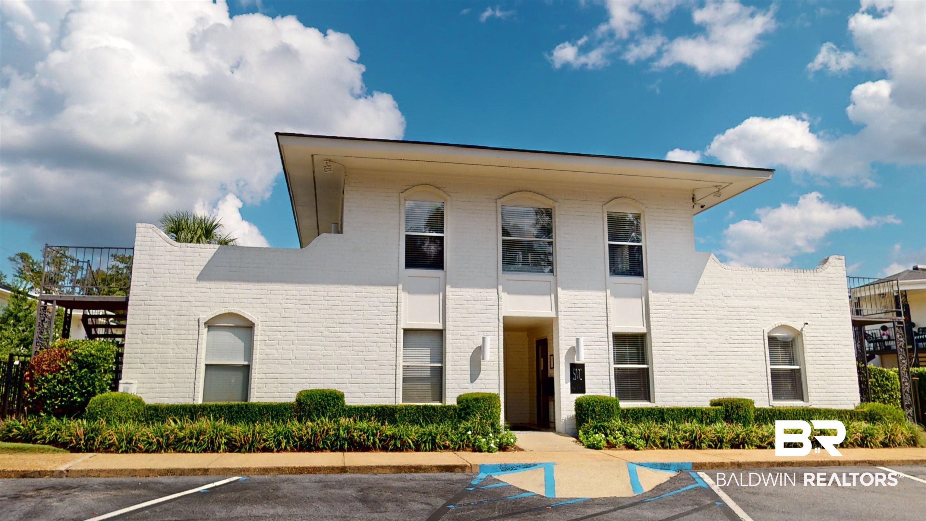 4009 Old Shell Road, Unit C13 Mobile, AL 36608 - Photo 29 of 32 View of building exterior featuring uncovered parking