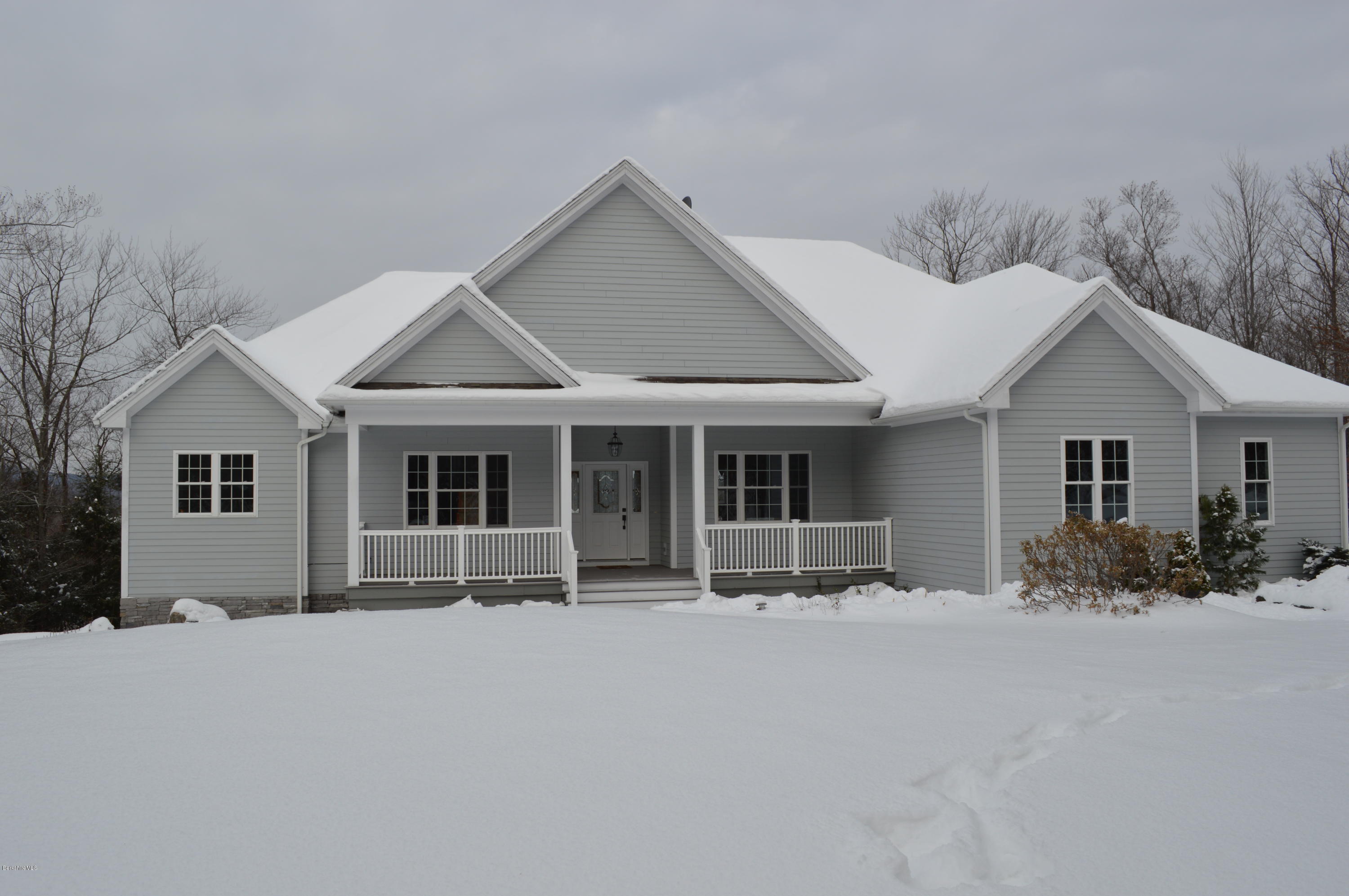 155 Valley View Road Becket, MA 01223 - Photo 3 of 56 a front view of house with yard outdoor seating and barbeque oven