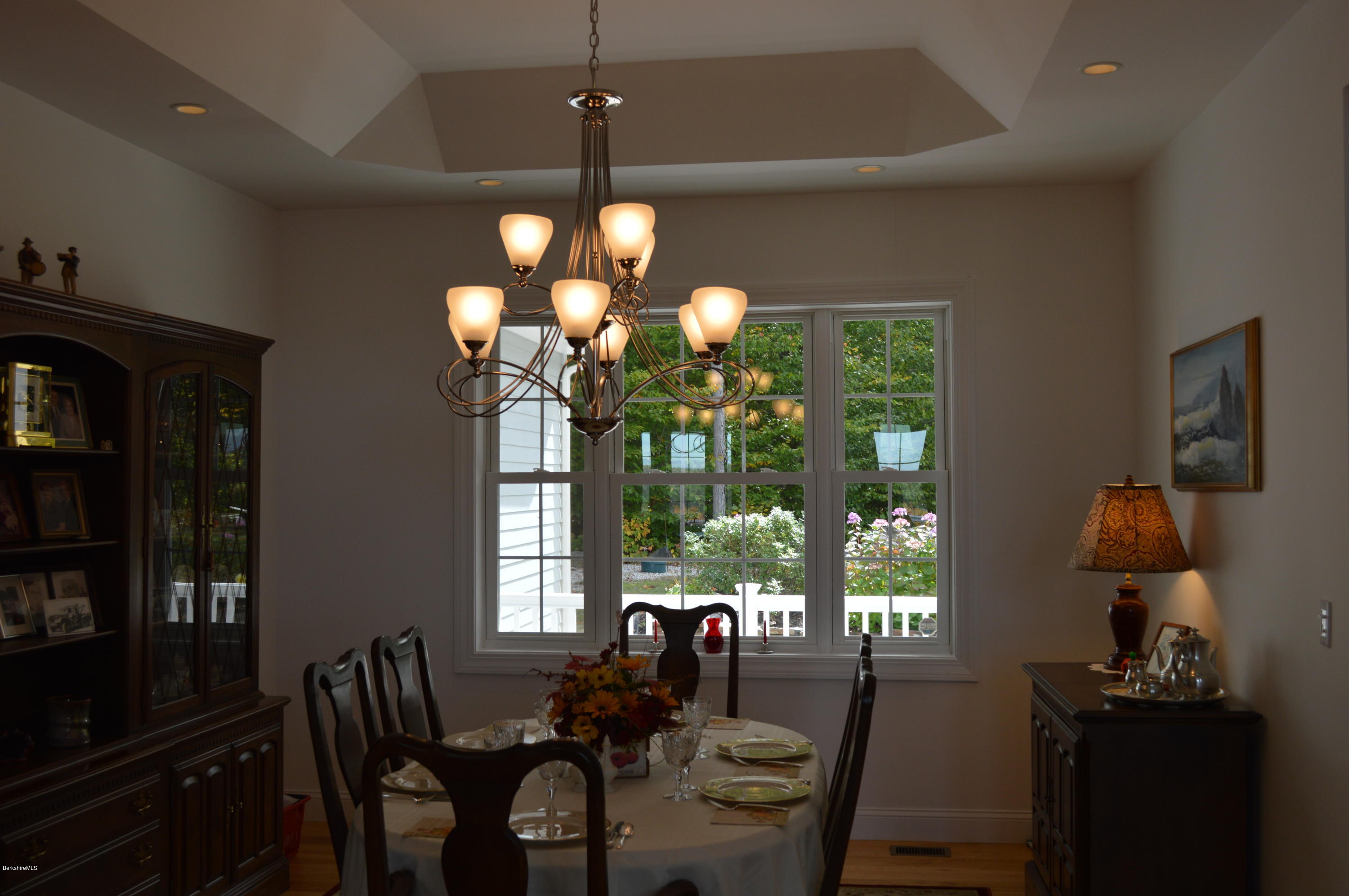 155 Valley View Road Becket, MA 01223 - Photo 22 of 56 a view of a dining room with furniture wooden floor and chandelier