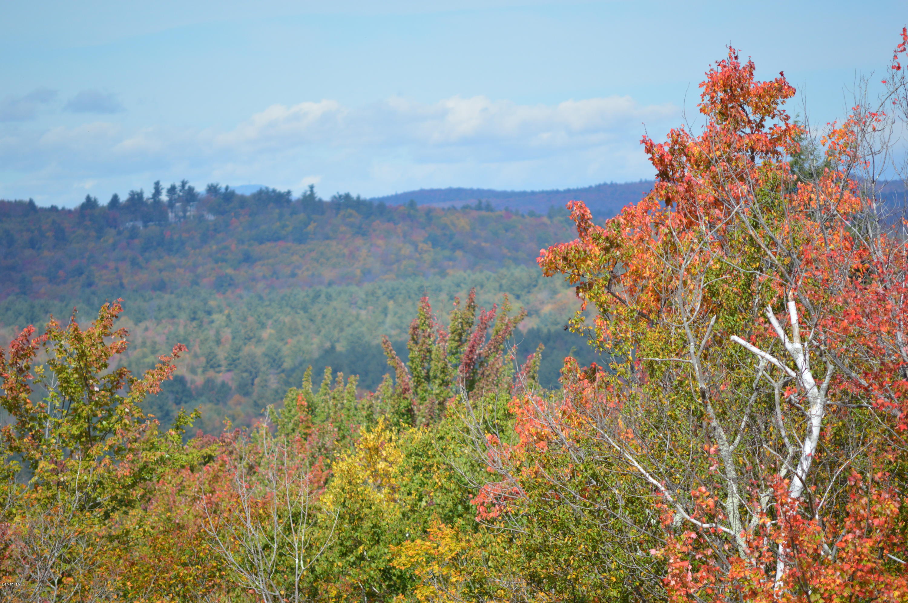 155 Valley View Road Becket, MA 01223 - Photo 40 of 56 a view of a lake with a mountain in the back