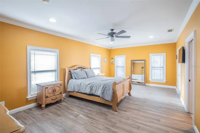 a spacious bathroom with a granite countertop sink mirror and bathtub