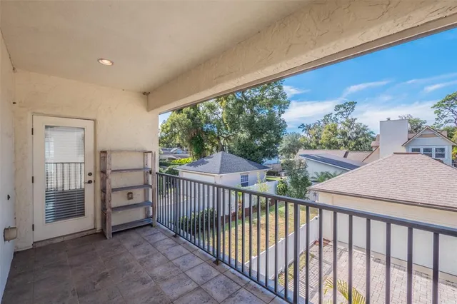 a bedroom with furniture and a wooden floor