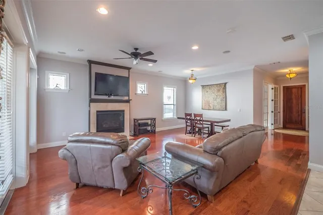 a view of a dining room with furniture and wooden floor