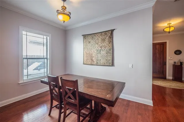 a kitchen with kitchen island granite countertop wooden cabinets and stainless steel appliances