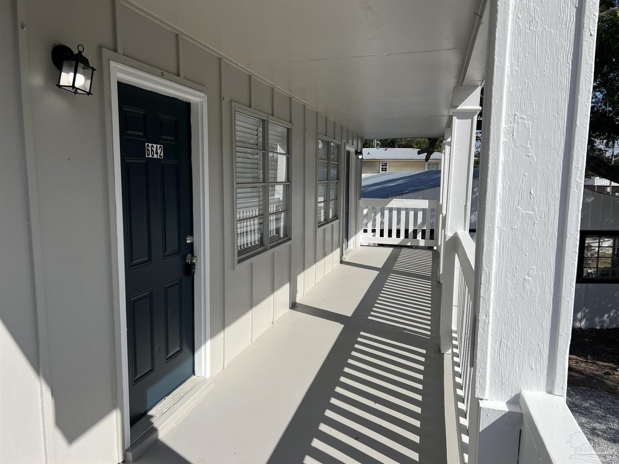 6642 Applegate Street Milton, FL 32570 - Photo 3 of 10 a view of balcony and wooden floor