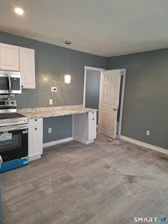 a view of a kitchen with a sink