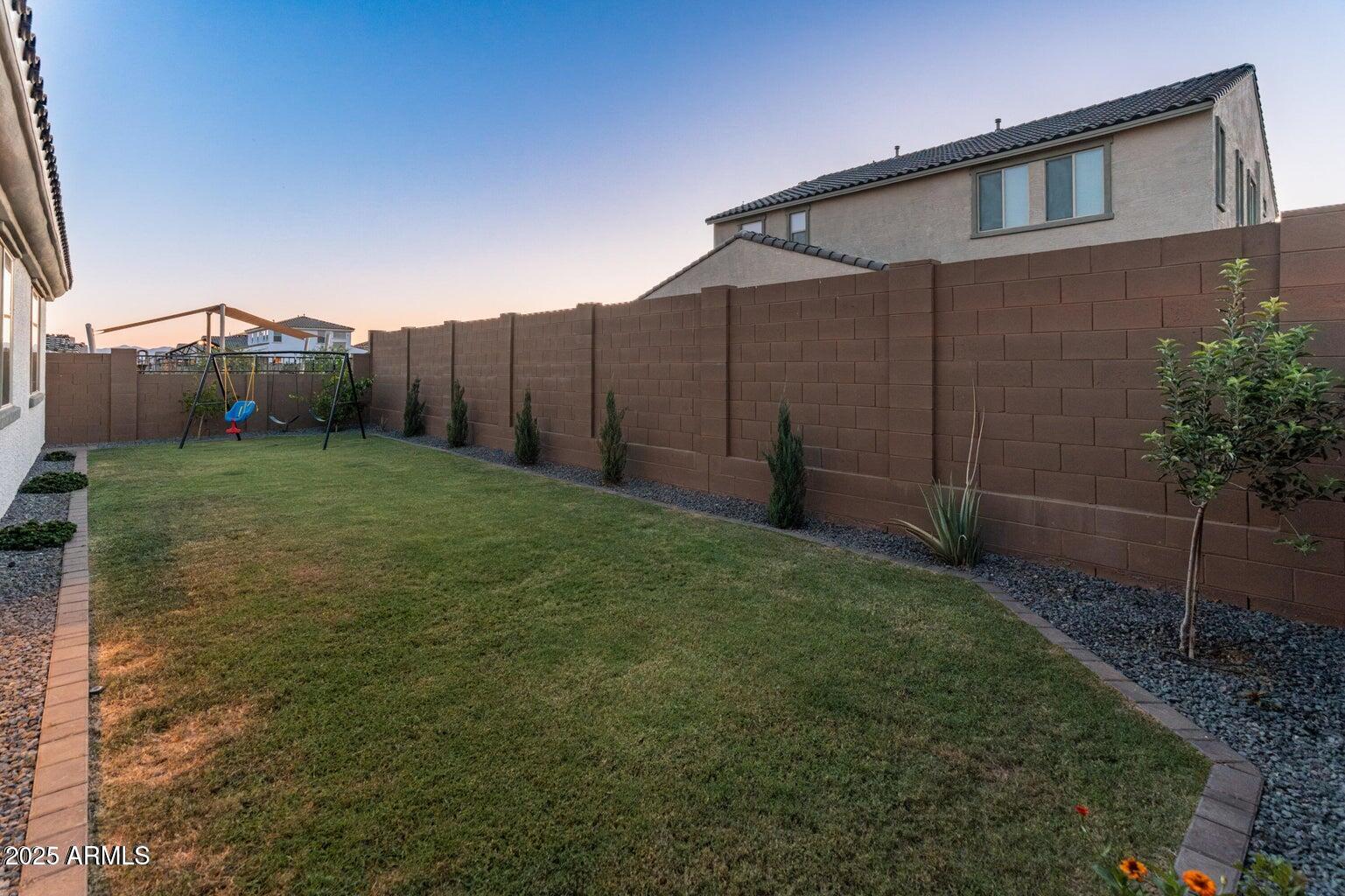 14274 West Sand Hills Road Surprise, AZ 85387 - Photo 20 of 24 a view of a back yard