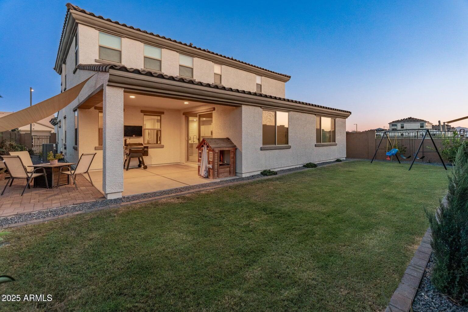 14274 West Sand Hills Road Surprise, AZ 85387 - Photo 21 of 24 a front view of a house with garden