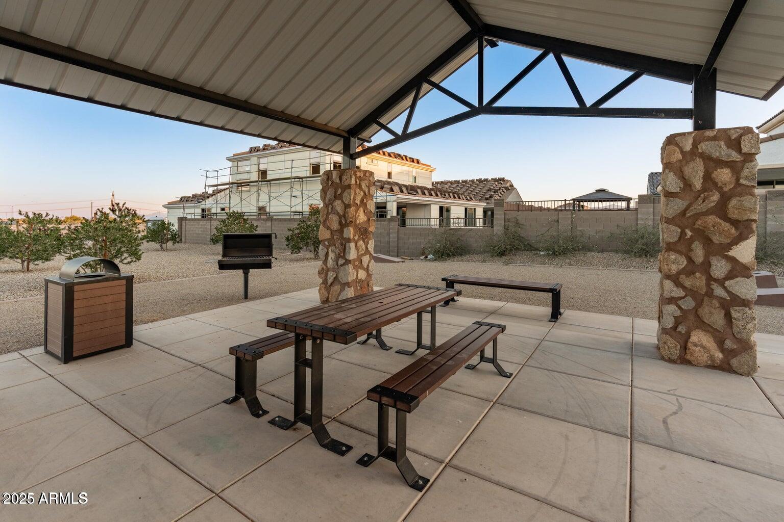 14274 West Sand Hills Road Surprise, AZ 85387 - Photo 23 of 24 a view of a chairs and table in the patio