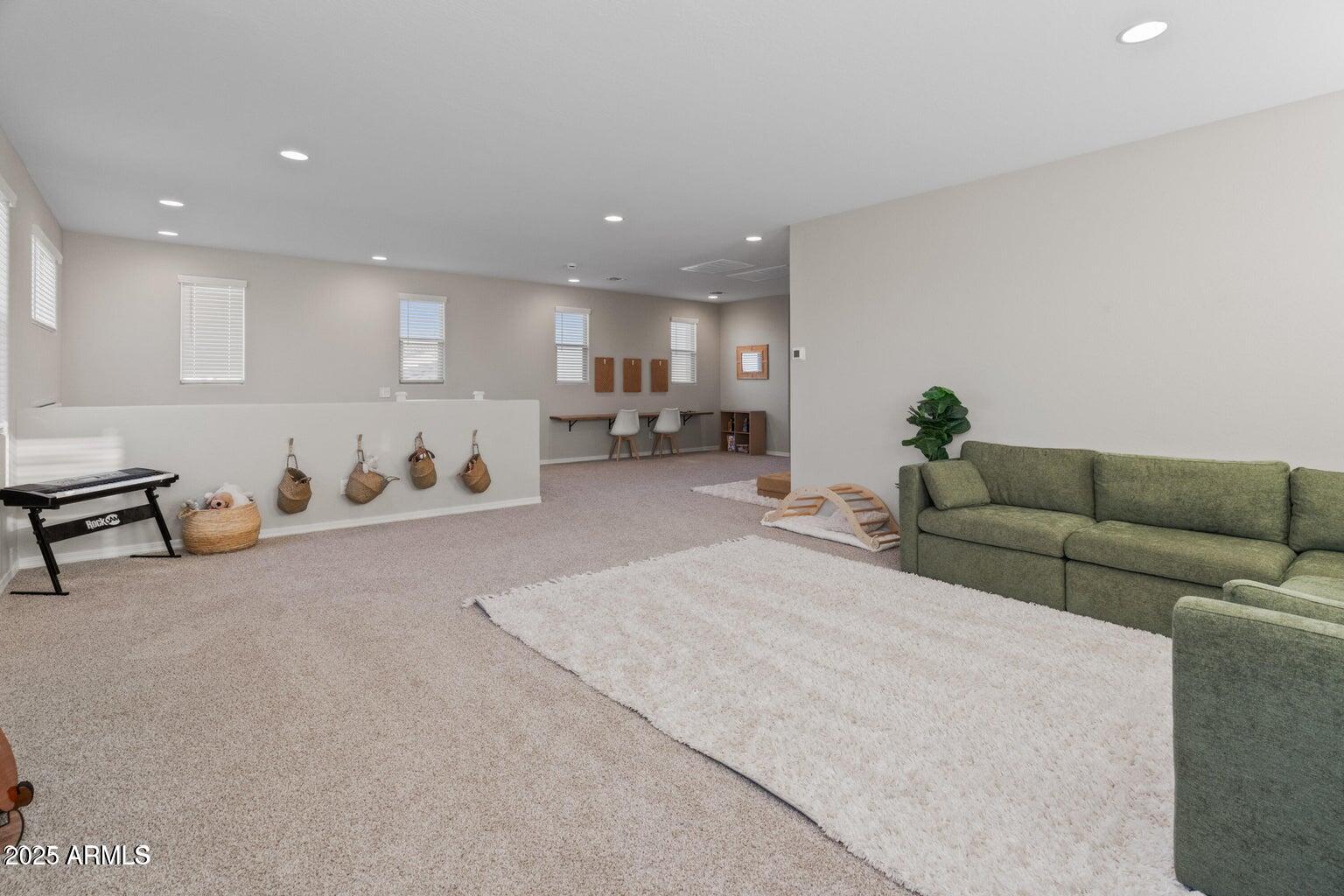 14274 West Sand Hills Road Surprise, AZ 85387 - Photo 3 of 24 a living room with furniture and kitchen view