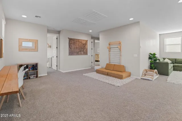 a bedroom with furniture and window