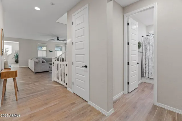 a view of a livingroom with furniture and hardwood floor