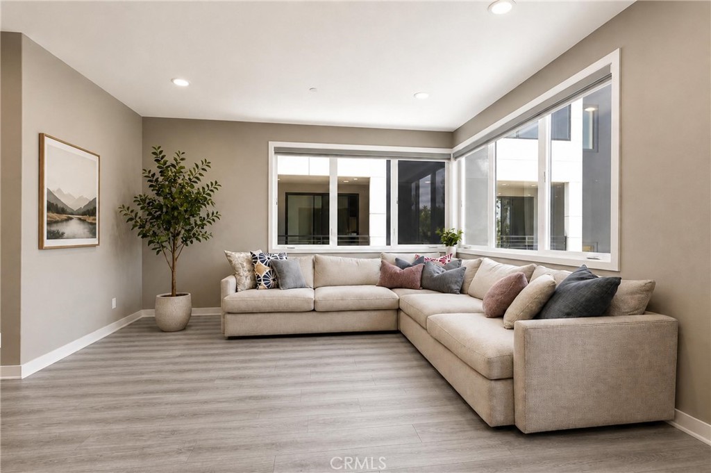 253 Waypoint Tustin, CA 92782 - Photo 16 of 56 large open living room with large windows