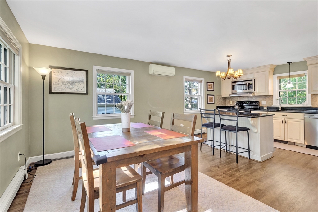 14 Hanson Street Dedham, MA 02026 - Photo 12 of 41 a view of a dining room with furniture and wooden floor