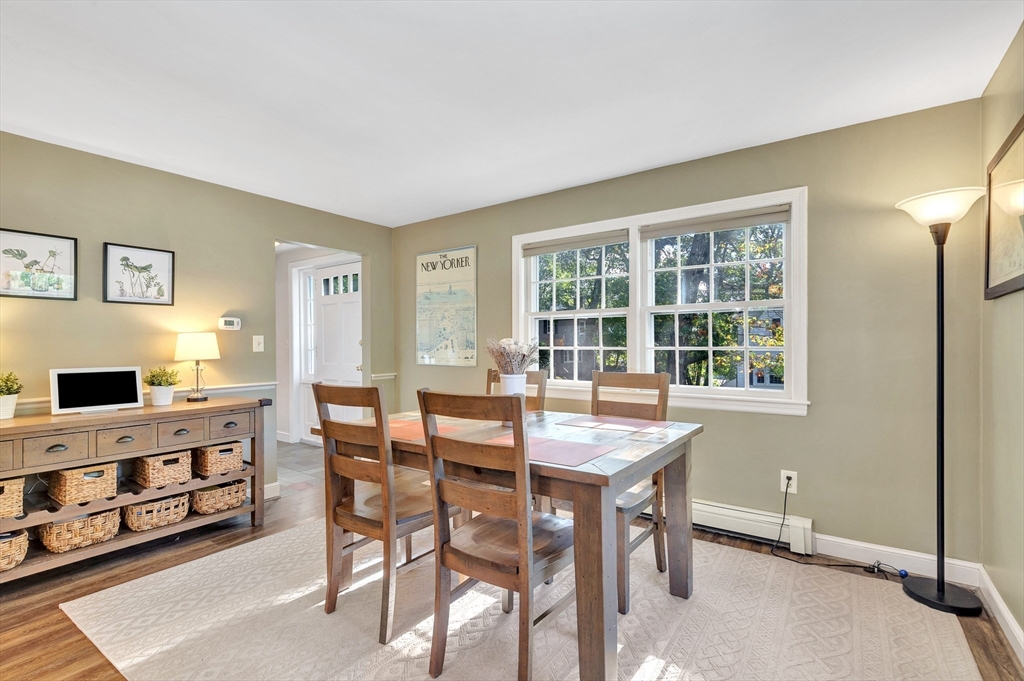14 Hanson Street Dedham, MA 02026 - Photo 15 of 41 a view of a dining room with furniture and chandelier