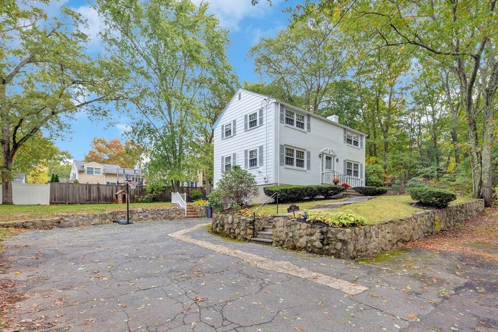 14 Hanson Street Dedham, MA 02026 - Photo 2 of 41 a white house that has a tree in front of it