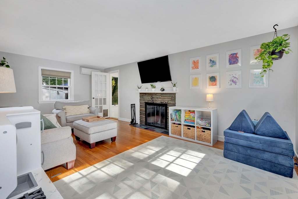 14 Hanson Street Dedham, MA 02026 - Photo 23 of 41 a living room with furniture and a fireplace